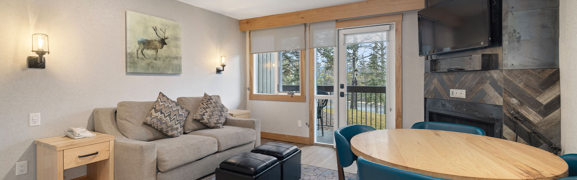 Living room with fireplace inside a Studio Condo at Tunnel Mountain Resort in Banff.