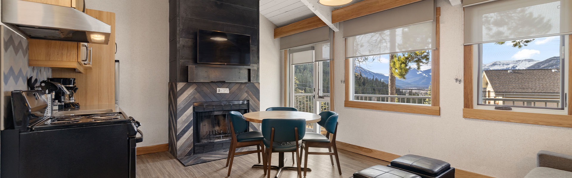 Living room with fireplace inside a Mountain Cabin at Tunnel Mountain Resort in Banff.
