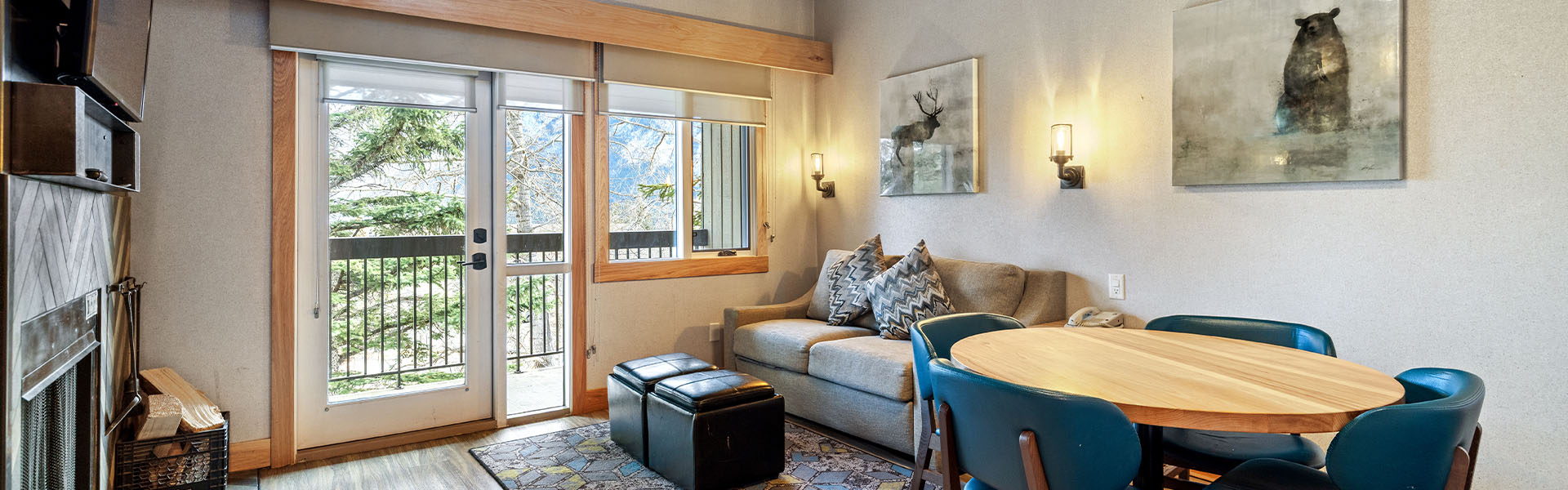 Living room with fireplace inside a One Bedroom plus Loft, Queen King at Tunnel Mountain Resort.